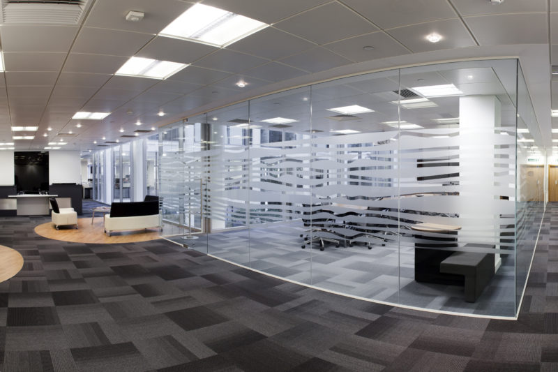 office refurbishment, meeting rooms with faceted full height glazing and mixed flooring